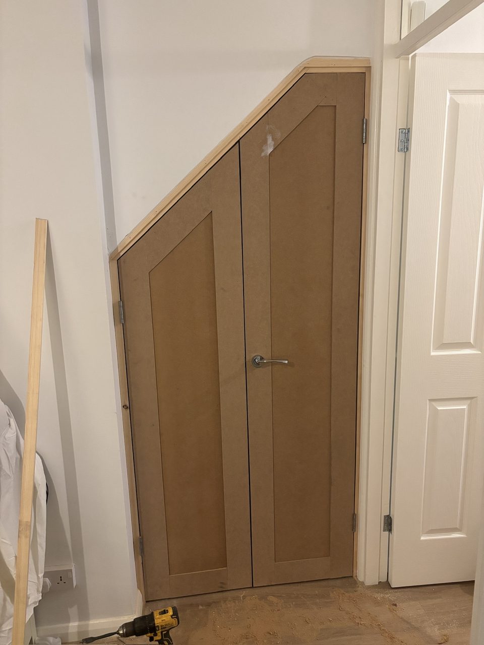 Angled double doors under a sloping ceiling
