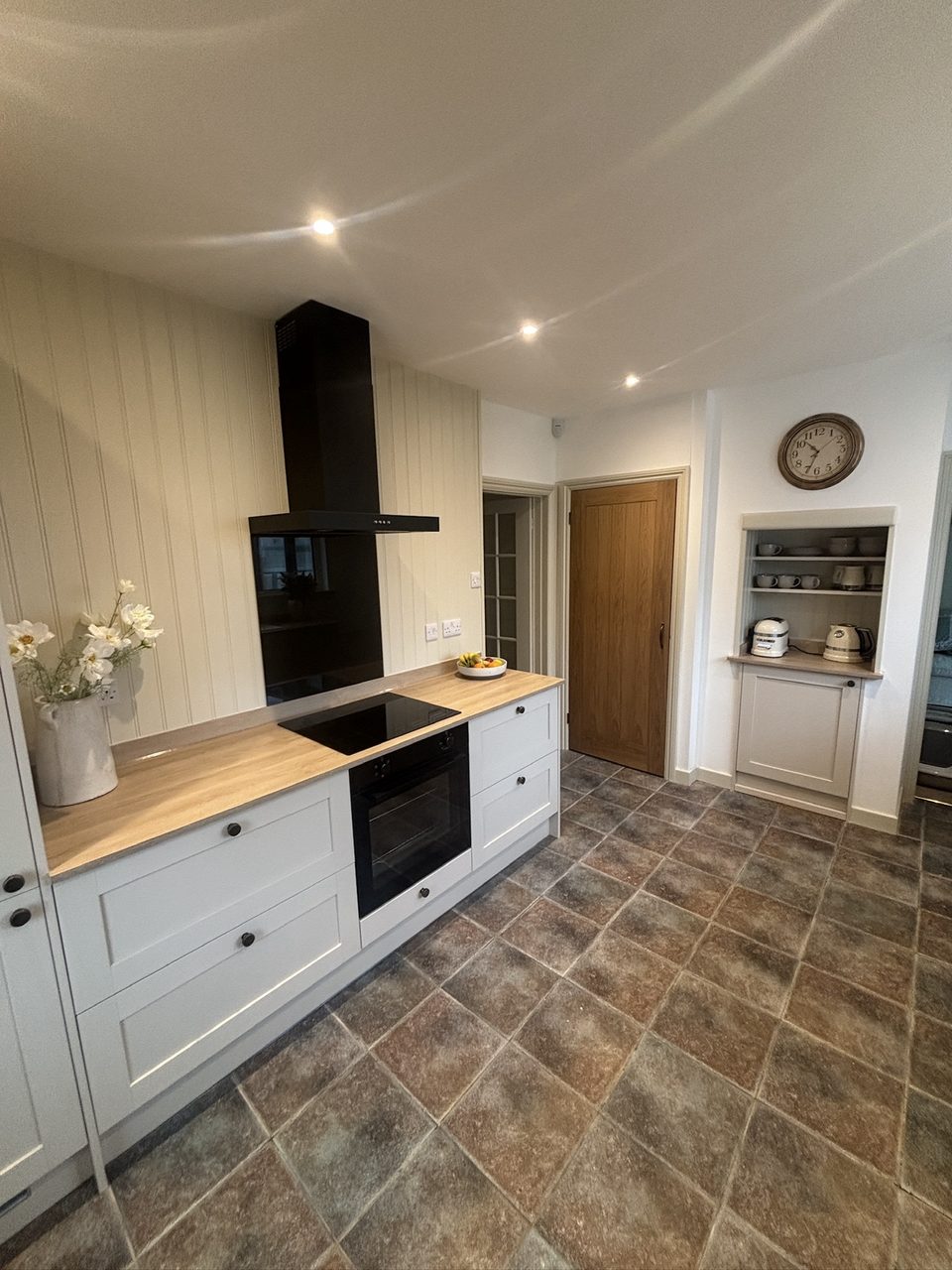 Finished kitchen with Shaker units, black hob and oven